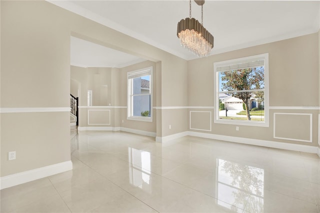 unfurnished room featuring light tile patterned flooring, ornamental molding, and a chandelier