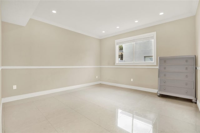 tiled empty room with crown molding