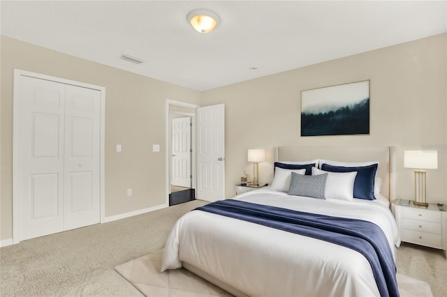 carpeted bedroom featuring a closet