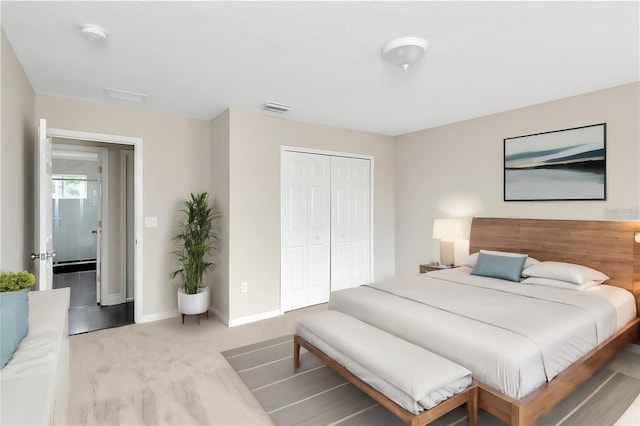 carpeted bedroom with a closet