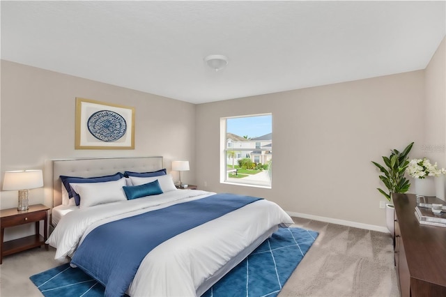 bedroom featuring light colored carpet