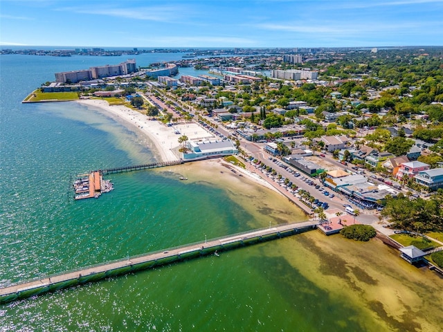 drone / aerial view featuring a water view and a beach view