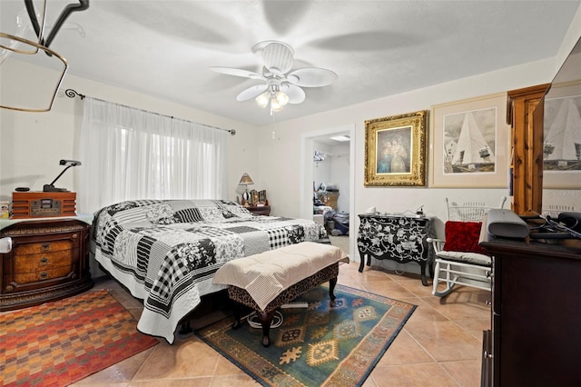 tiled bedroom with ceiling fan