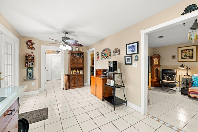 kitchen with ceiling fan and light tile patterned flooring