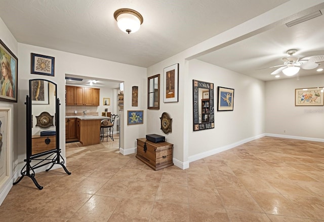 hallway with light tile patterned floors