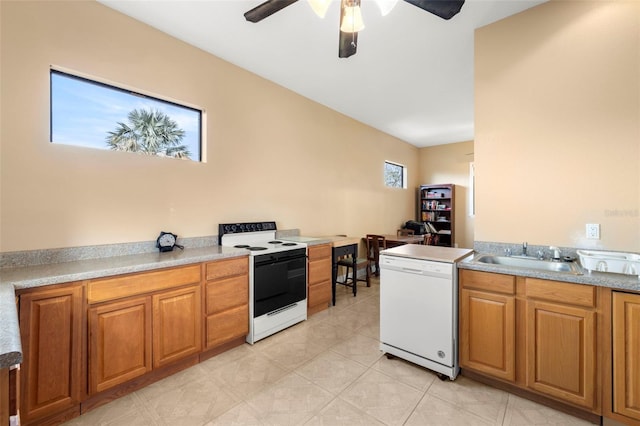 kitchen with dishwasher, electric range oven, sink, and ceiling fan