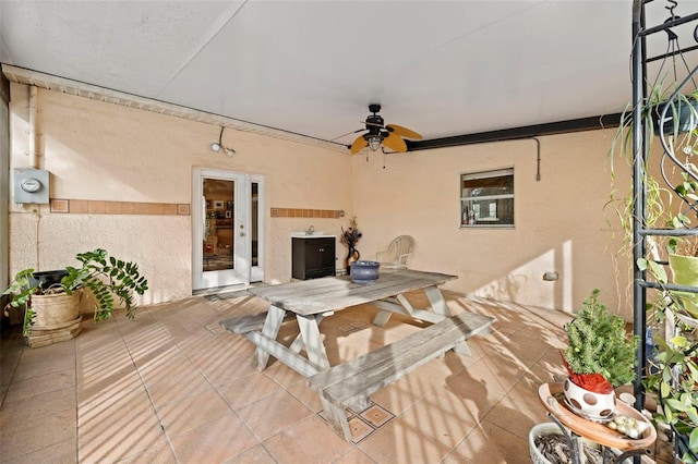 view of patio / terrace featuring outdoor dining space and a ceiling fan