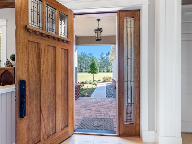 entrance foyer with light tile patterned floors