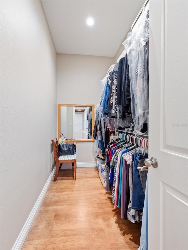 spacious closet featuring light hardwood / wood-style flooring