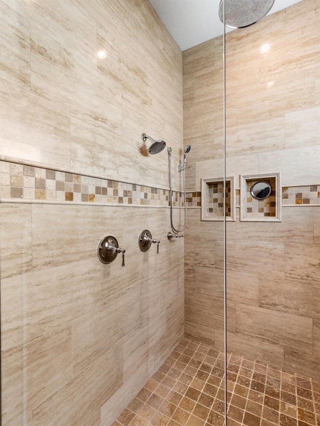 bathroom featuring tiled shower