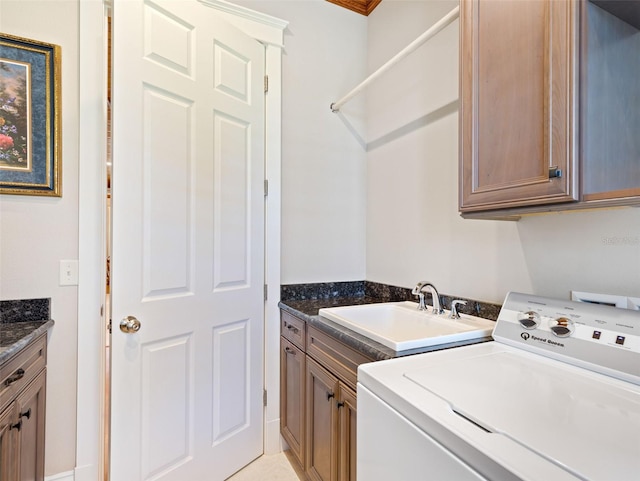 clothes washing area featuring cabinets, crown molding, washer / dryer, and sink