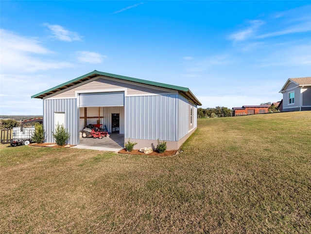 view of outbuilding with a yard