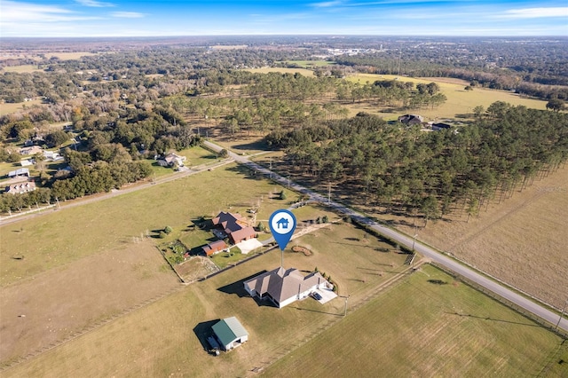 birds eye view of property featuring a rural view