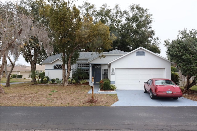 ranch-style house with a garage and a front yard