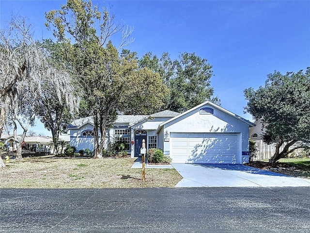 single story home featuring a garage