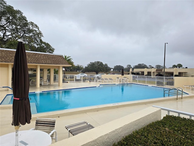 view of swimming pool with a patio