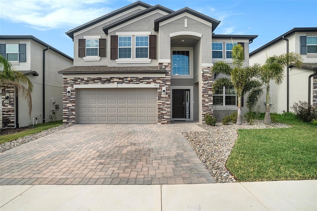 view of front facade featuring a garage and a front lawn