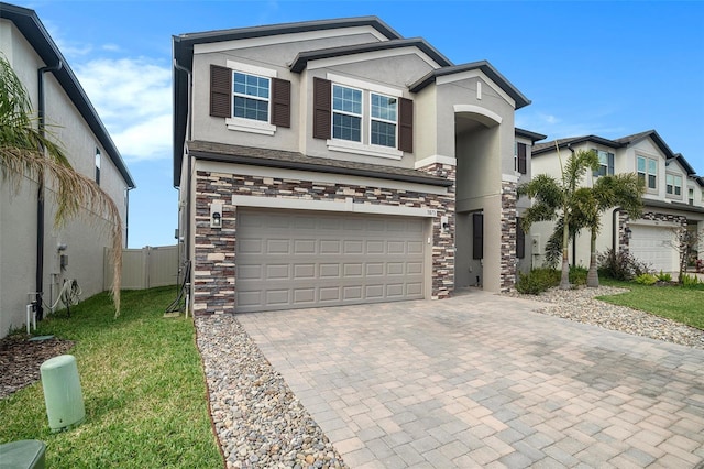 view of front of home featuring a garage and a front lawn