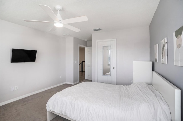 bedroom with ceiling fan and carpet