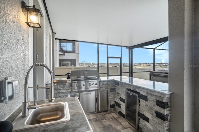 kitchen featuring wine cooler, sink, and refrigerator