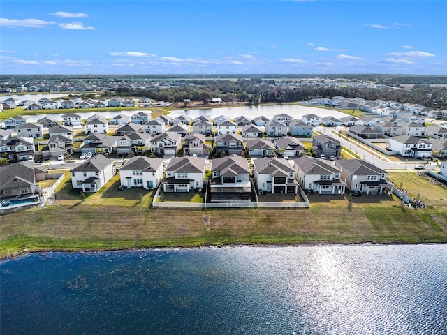 drone / aerial view with a water view