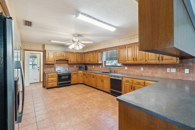 kitchen with sink, range, stainless steel refrigerator, dishwasher, and ceiling fan