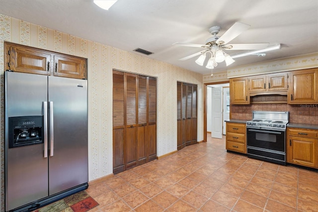 kitchen featuring stainless steel fridge with ice dispenser, light tile patterned floors, electric range, ceiling fan, and decorative backsplash