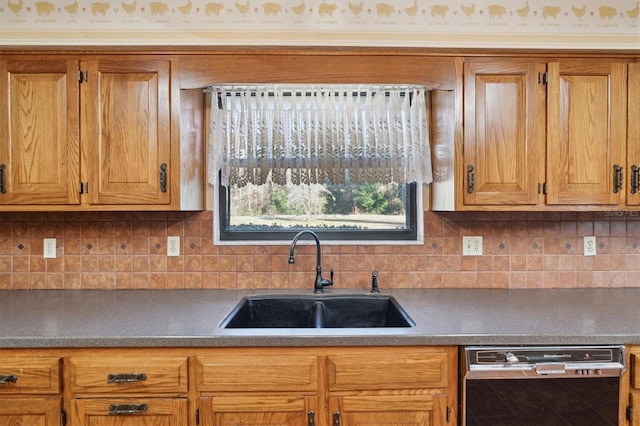 kitchen with sink, decorative backsplash, and black dishwasher