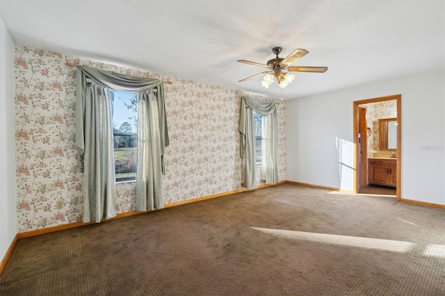 carpeted empty room featuring ceiling fan