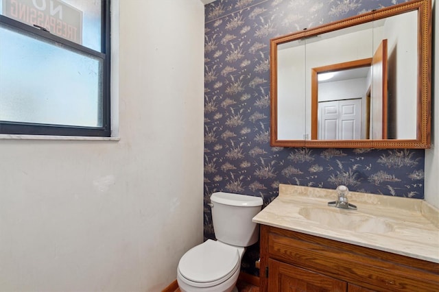 bathroom with vanity and toilet