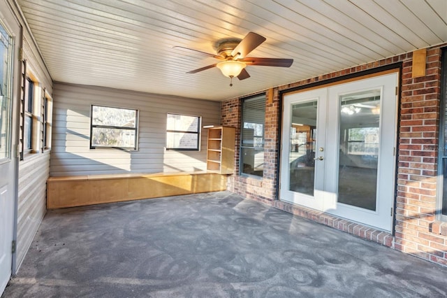 unfurnished sunroom with french doors