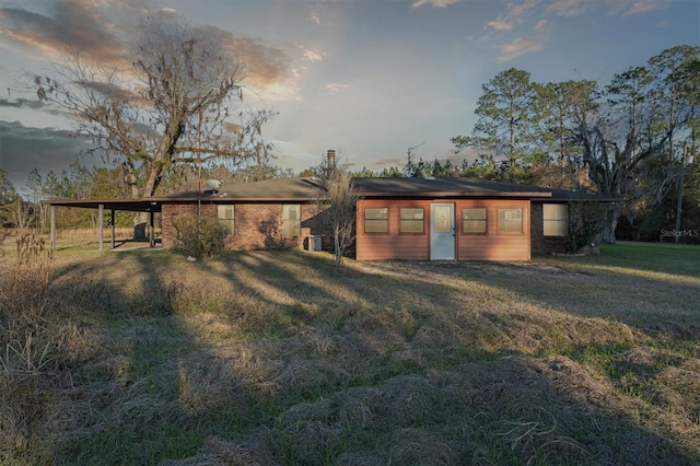 yard at dusk with a carport