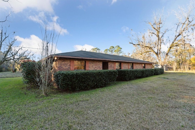 view of property exterior with a yard