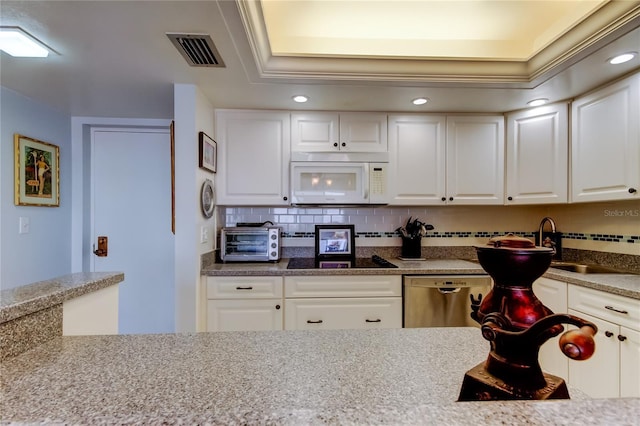 kitchen featuring white cabinets, backsplash, light stone countertops, and dishwasher