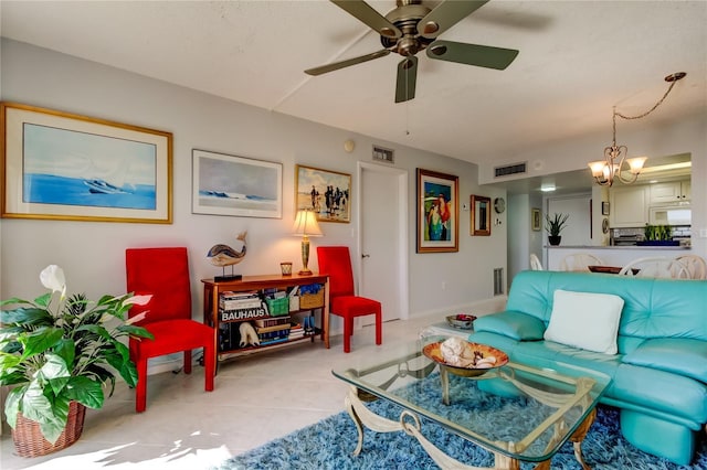 tiled living room with ceiling fan with notable chandelier