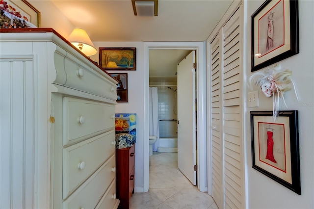 hallway featuring light tile patterned floors