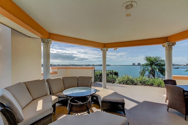 view of patio with a water view and an outdoor hangout area