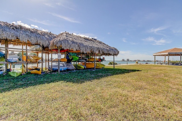 view of yard with a gazebo and a water view