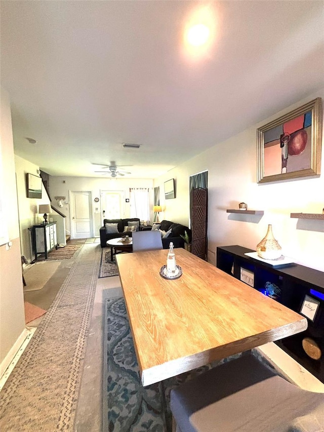 dining space featuring ceiling fan