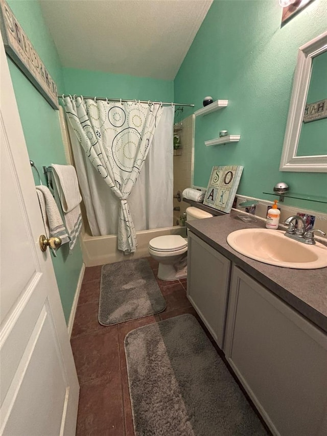 full bathroom with vanity, shower / tub combo, and toilet