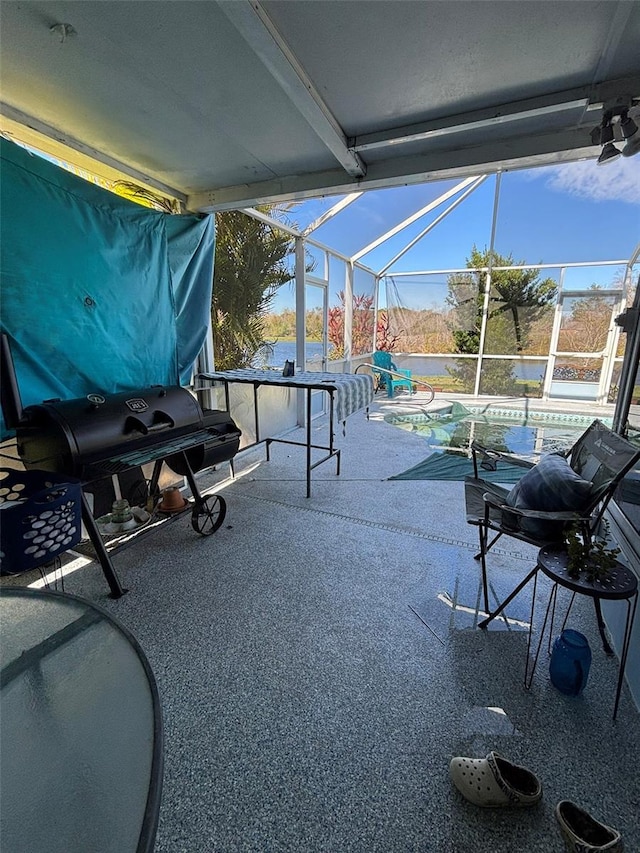 view of patio with a pool and a lanai