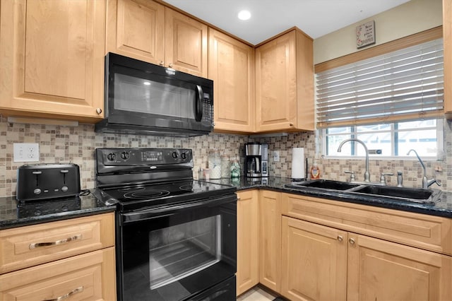 kitchen with sink, dark stone countertops, backsplash, black appliances, and light brown cabinets