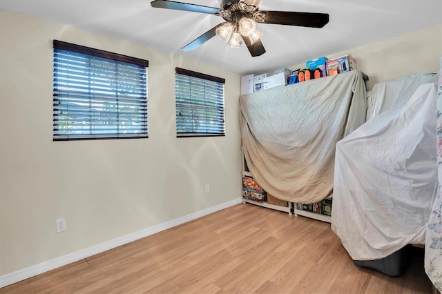 bedroom featuring hardwood / wood-style floors and ceiling fan