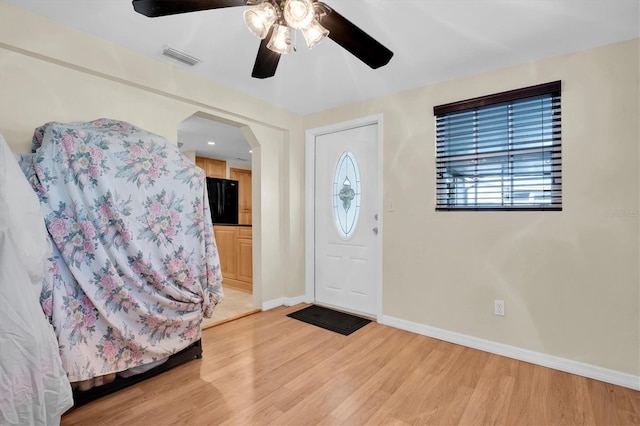 foyer entrance with light hardwood / wood-style flooring