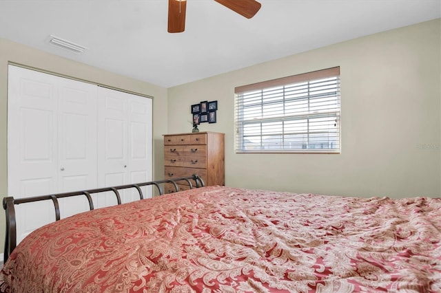 bedroom featuring ceiling fan and a closet