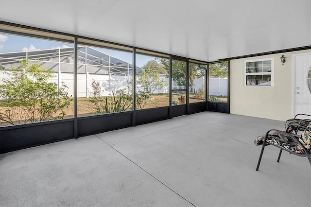 unfurnished sunroom with plenty of natural light