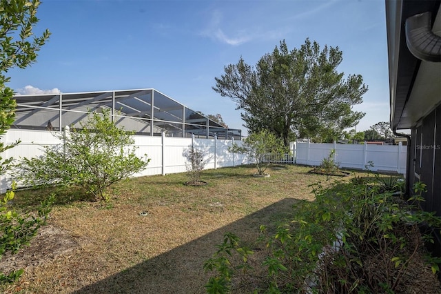 view of yard featuring glass enclosure