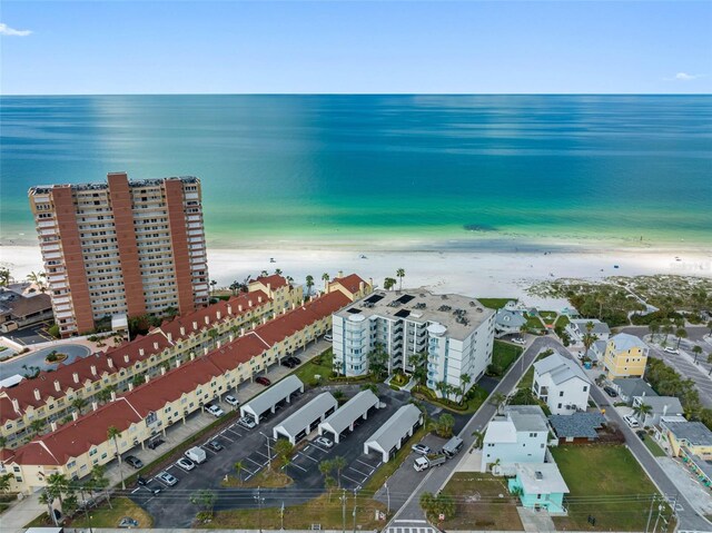 aerial view with a water view and a view of the beach