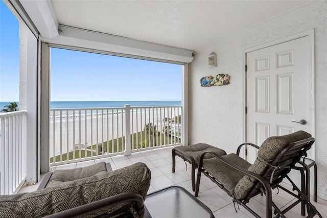 balcony with a view of the beach and a water view