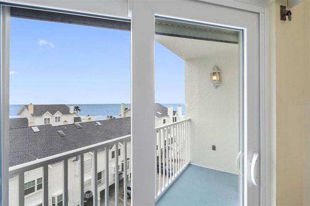 balcony featuring a water view